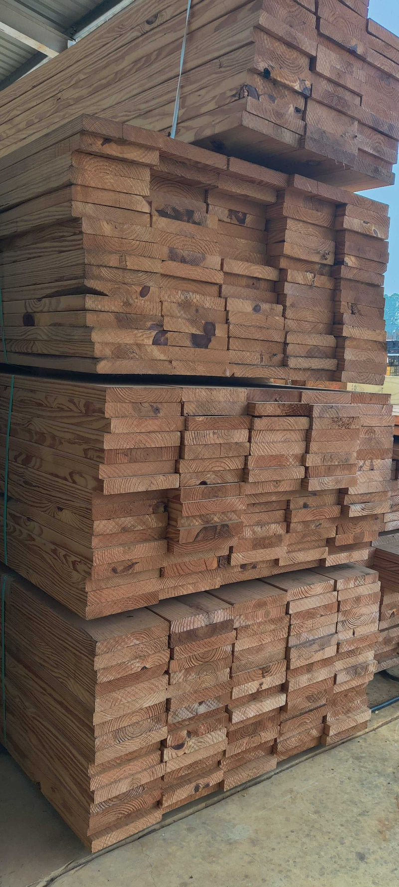 Lumber stacked and ready in the yard
